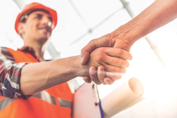 Handshaking with a Construction Worker