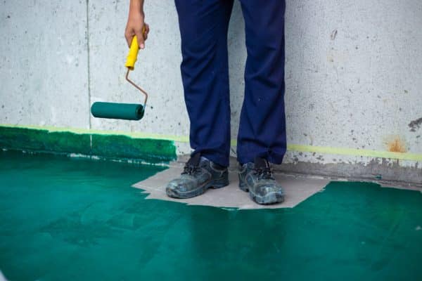Worker Painted everywhere in green, except his feet