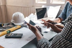 A Man Explaining a Plan with a Tablet