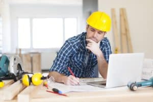 A Man Working on a Construction Plan