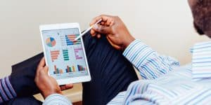 A Man Analyzing Plans on his Tablet