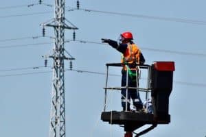 A Construction Worker on a Lift analyzing the construction site for safety