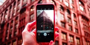 A Person taking a photo of a building