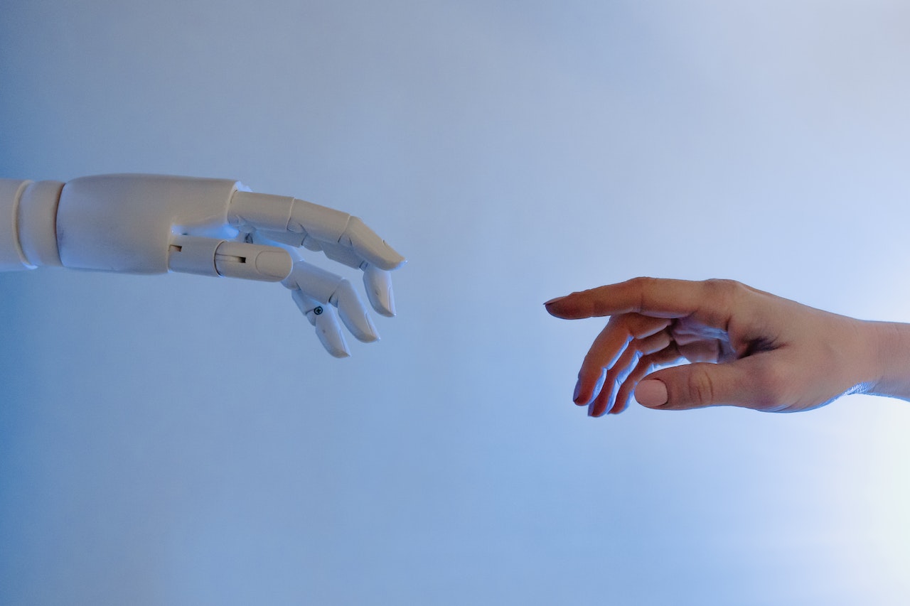 A robot's hand approaching to a human's hand