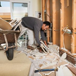 Construction worker cleaning up.