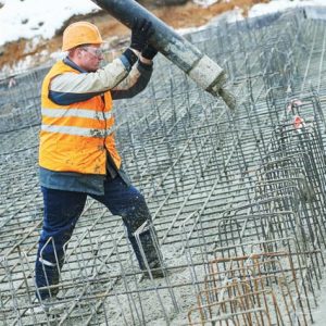 Construction workers are pouring cement.