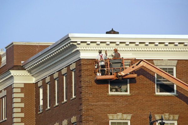 workers painting a building